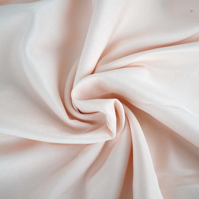 Soft pink fabric with elegant draping and smooth texture.