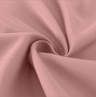 Soft pink fabric with smooth texture and gentle drape.