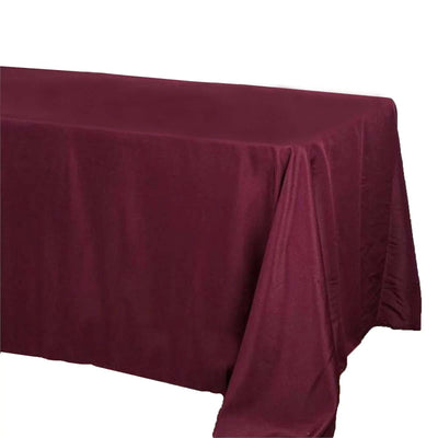 Burgundy tablecloth draped over a table