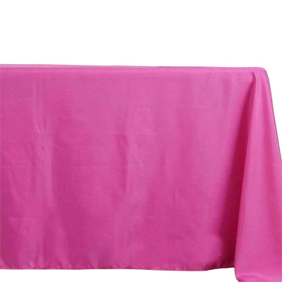 Bright pink tablecloth on a plain backdrop.