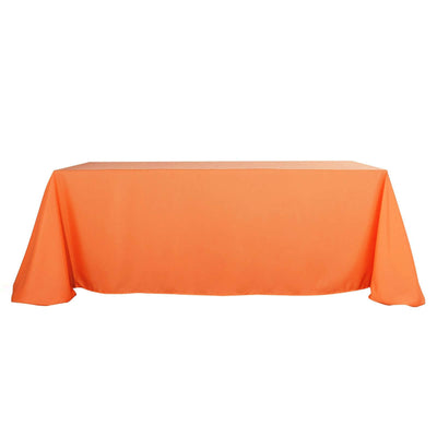 Orange tablecloth on a plain backdrop