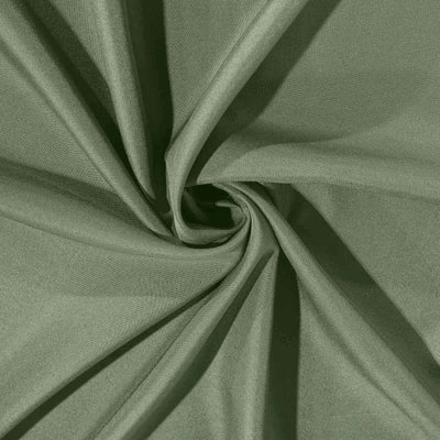 Green fabric texture with soft, smooth draping.