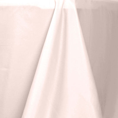Light pink tablecloth draping elegantly over a table.