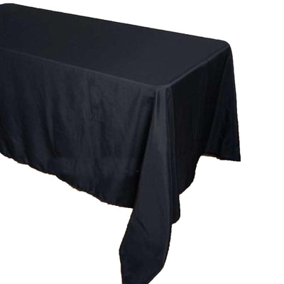 Black tablecloth draped over a table, showcasing elegant fabric texture.
