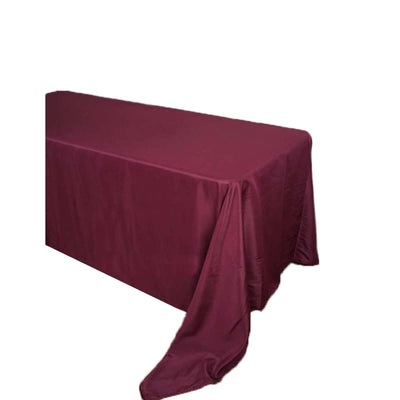 Burgundy tablecloth draped elegantly over a rectangular table