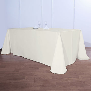 Elevate Your Event with the Ivory Seamless Polyester Rectangular Tablecloth
