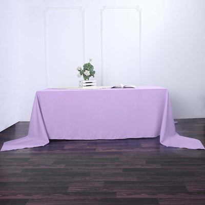 Purple tablecloth draped elegantly on a wooden table.
