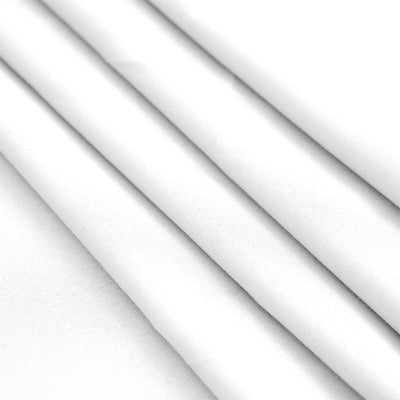 White fabric draped in folds, showcasing smooth texture and clean lines.