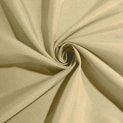 Beige fabric with smooth texture, ideal for sewing and upholstery projects.