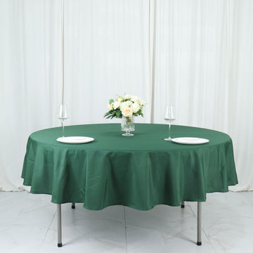 Add Elegance to Your Event with the Hunter Emerald Green Seamless Polyester Round Tablecloth 90"