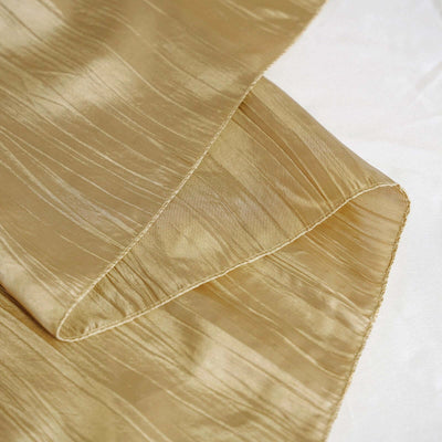Gold textured fabric draped elegantly on a surface.