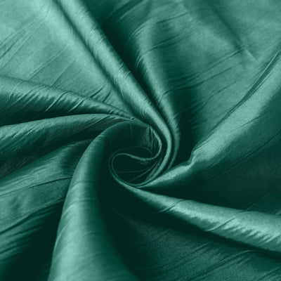 Luxurious green silk fabric with a smooth, shiny texture.