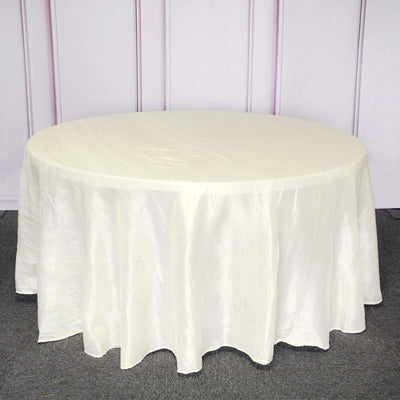 White round tablecloth draped over a circular table.