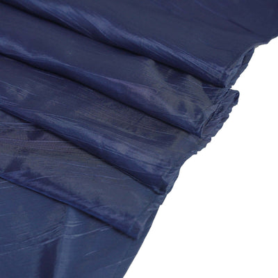 Navy blue textured fabric draped in folds