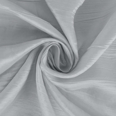 Silky gray fabric in a spiral pattern on a plain background.