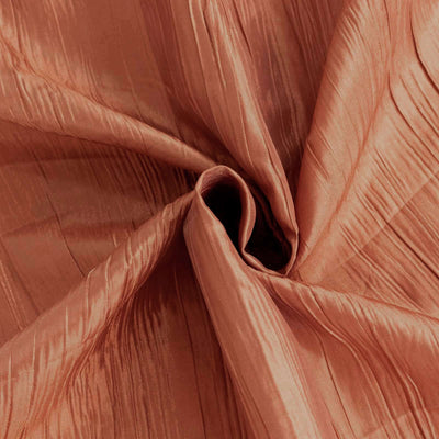 Textured copper fabric with elegant pleats and sheen.