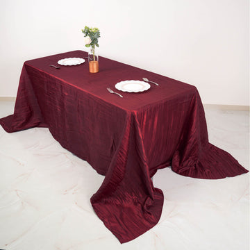 Elevate Your Event with the Burgundy Accordion Crinkle Taffeta Seamless Rectangular Tablecloth