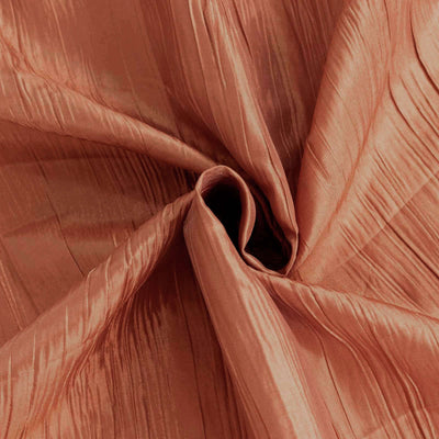 Textured rust fabric with elegant pleats and sheen.