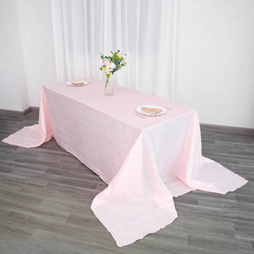 Elevate Your Event with the Blush Accordion Crinkle Taffeta Seamless Rectangular Tablecloth