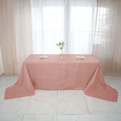Peach tablecloth draped elegantly over a table with minimalist décor.