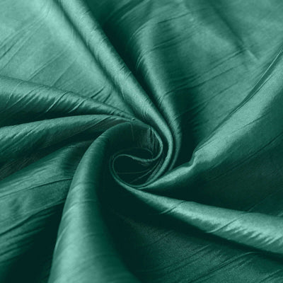 Emerald green silk fabric with a smooth, lustrous texture.