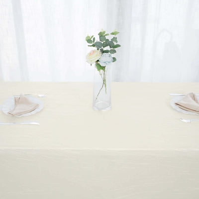 Elegant table setting with a vase of flowers and neatly arranged napkins.