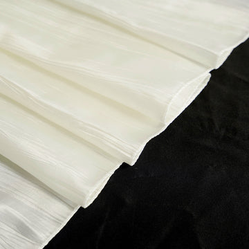 Create a Timeless and Memorable Event with the Ivory Accordion Crinkle Taffeta Seamless Rectangular Tablecloth
