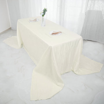 Elevate Your Event Decor with the Ivory Accordion Crinkle Taffeta Seamless Rectangular Tablecloth