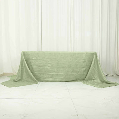 Green textured tablecloth draped elegantly on a table.