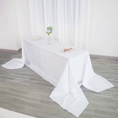 White tablecloth draped over a table with decorative elements