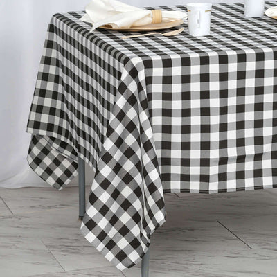 Black and white checked tablecloth draped over a table