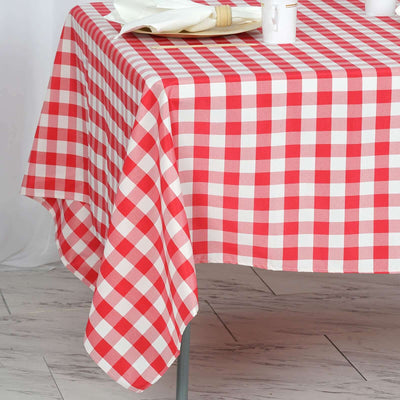 Red and white checkered tablecloth draping over a table.