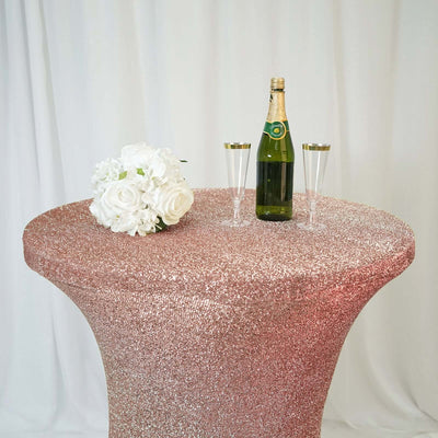 Sparkling table with champagne, flutes, and floral arrangement in a festive setting.