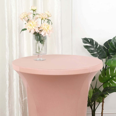Pink cocktail table with floral arrangement and greenery