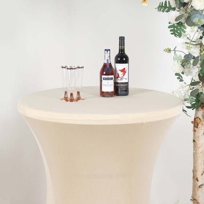 Bistro table with drinks and glasses on a neutral background.