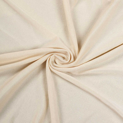 Beige textured fabric swirled in a spiral pattern.