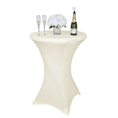 Elegant cocktail table with champagne, flutes, and floral centerpiece