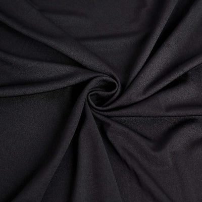 Black stretchy fabric with a smooth texture in a spiral arrangement.