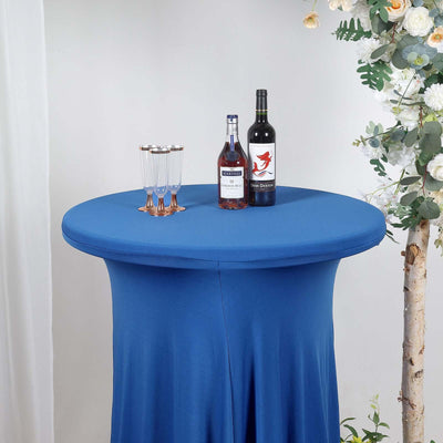 Blue stretch table cover with drinks and glasses on a cocktail table.