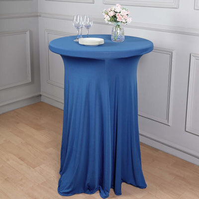 Blue fitted table cover with elegant draping for events and gatherings.