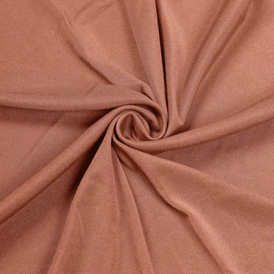 Brown textured fabric in a swirling pattern.