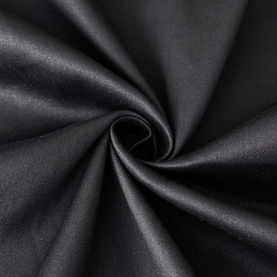 Black satin fabric with a smooth texture, elegantly draped in a spiral.