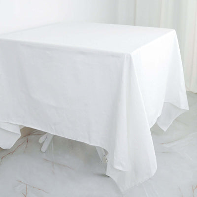 White tablecloth draped over a table on a plain background