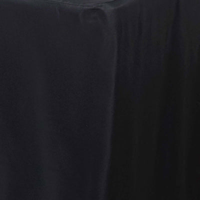 Black tablecloth draping elegantly over a table edge.