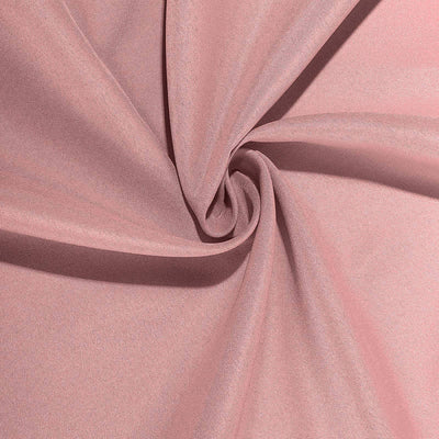 Soft pink fabric swirl, showcasing texture and drape.
