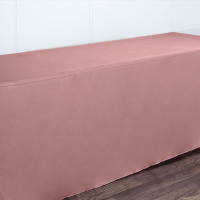 Pink table cover draped over a table in a minimalist setting.
