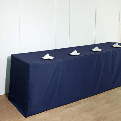 Navy table cover with napkins on a table in a clean setting.