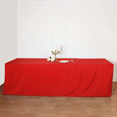Red tablecloth draped over a table for events or dining.