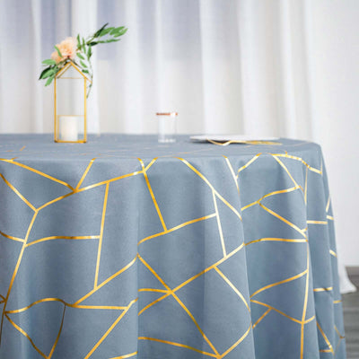 Elegant blue tablecloth with gold geometric design. Perfect for stylish dining settings.