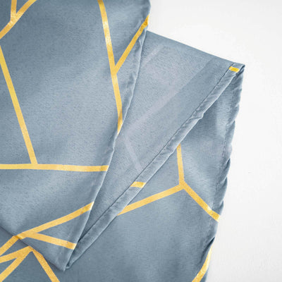 Gray fabric with gold geometric pattern folds